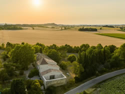 Aerial sunset view of Domaine des Périès overlooking the Lauragais countryside, South of France