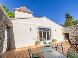 View of the manor tower from the terrace, traditional architecture under a blue sky