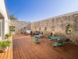 Outdoor dining area on the wooden patio, perfect for fresh summer breakfasts