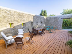 Comfortable outdoor lounge area on the estate's large wooden terrace
