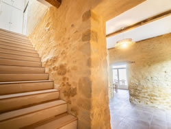 Rustic wooden staircase and preserved heritage architecture of the 17th-century estate