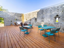 Sunny patio with garden furniture, an ideal place to relax in the heart of Occitanie